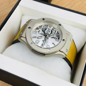 Hb (yellow strap with silver dial)